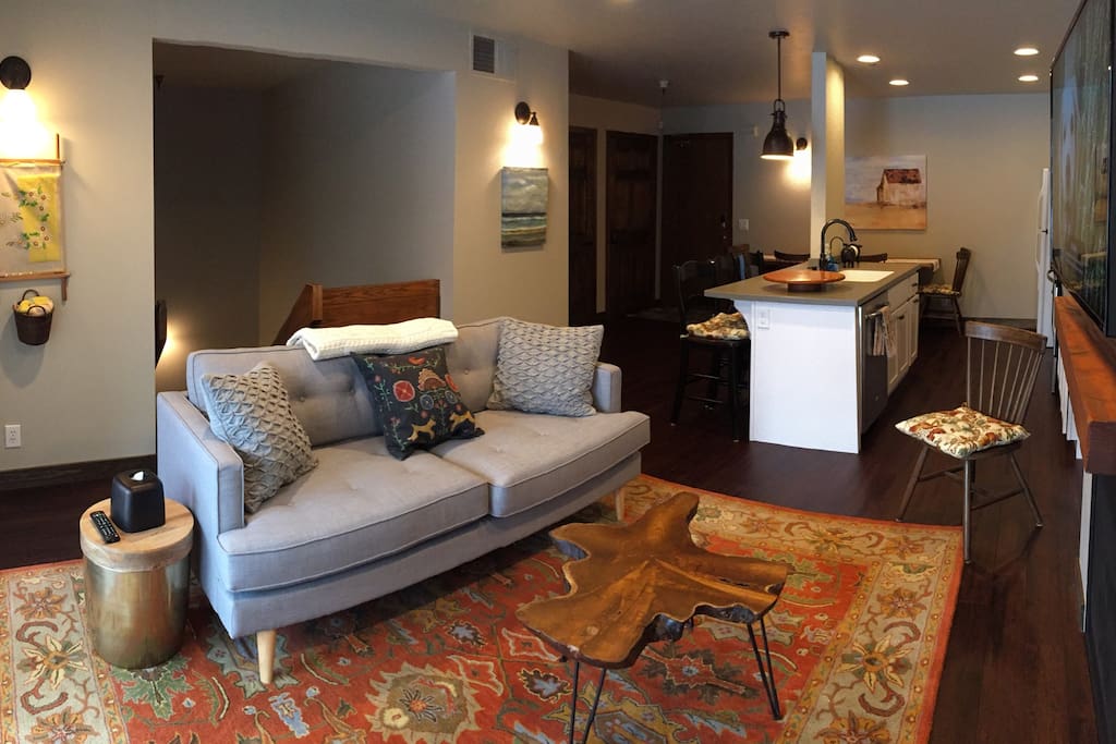 Upstairs great room with full kitchen and living room. Cozy fireplace, 4K TV and a view of the slopes out the window/sliding glass doors.
