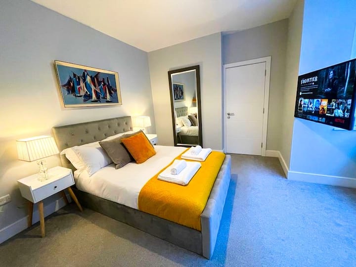 The Queen bedroom with a large ensuite is located on the ground floor, and a 49" smart TV.