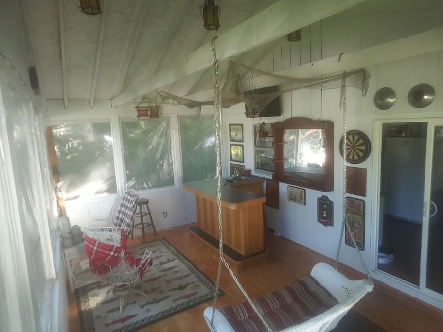 Updated Paint and floors!Still same great view of backyard, With tv, dart board and disco lights