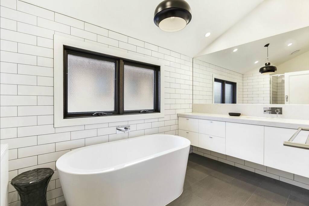 Upstairs bathroom includes large bath and separate shower