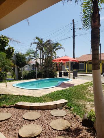 Entire home with 4 bedrooms in Tramandaí - Casa da Praia com piscina [até 12 hóspedes]