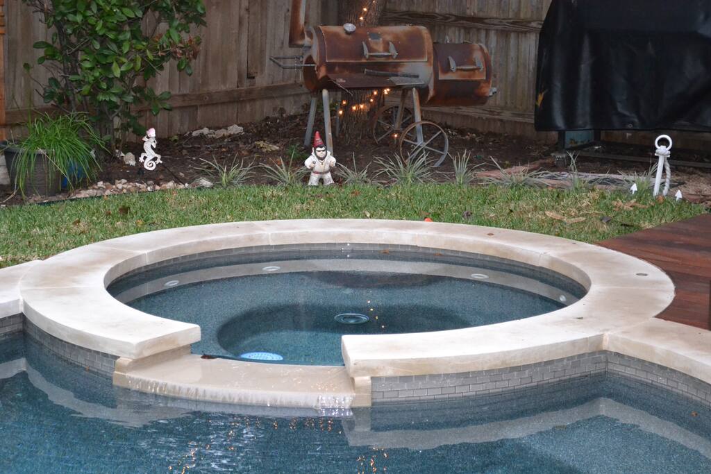 Pool, hot tub, outdoor dining, bar, and lounge area.