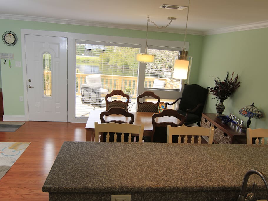 Open floor plan, window and deck overlook pond with local wild life