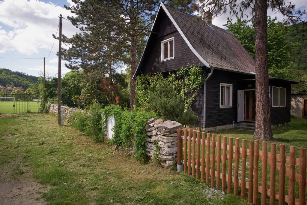 A front of property is firm surface. It´s dead-end street where you can park your car.