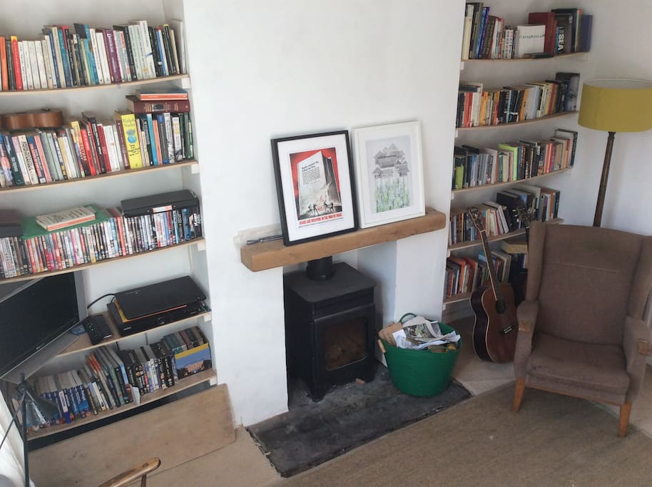 Front room (TV with freeview, wood-burning stove, lounge chair)