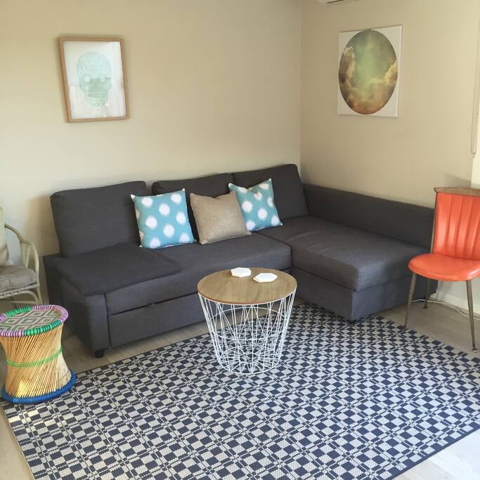 Our light and bright living room- very comfy fold out sofa.