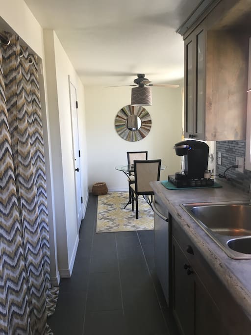 Kitchen with washer/dryer nook.