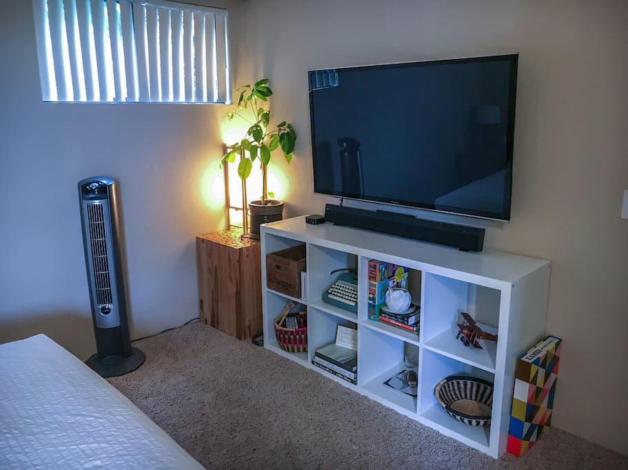 50" TV in room with Apple TV: Netflix, HBO, and Hulu.