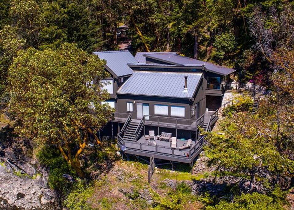 View of waterfront deck and picture windows overlooking beautiful Eastsound, Orcas Island