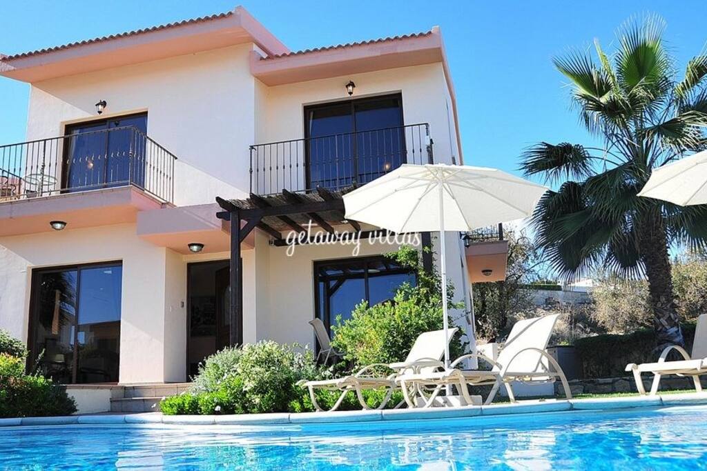 Manicured gardens surround the secluded private swimming pool.