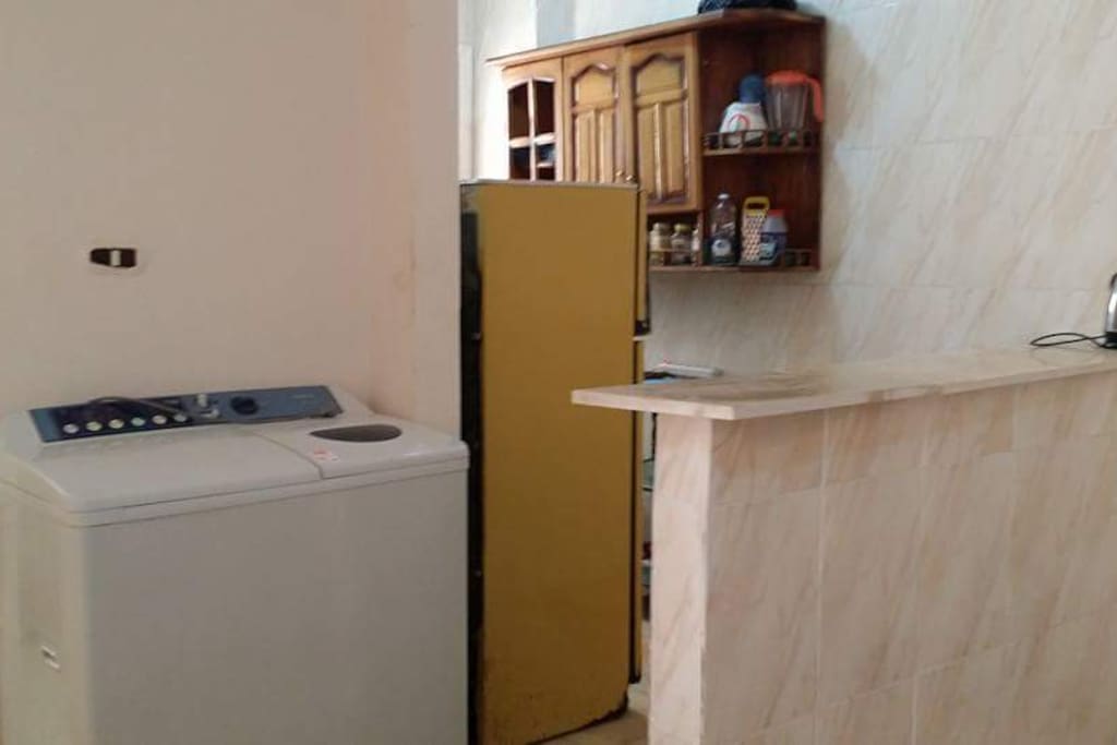 American kitchen next to the washing machine with the possibility of providing laundry and ironing service at another price.