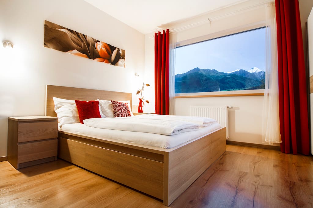 Enjoy the view of the Alps right from your comfortable bed.
