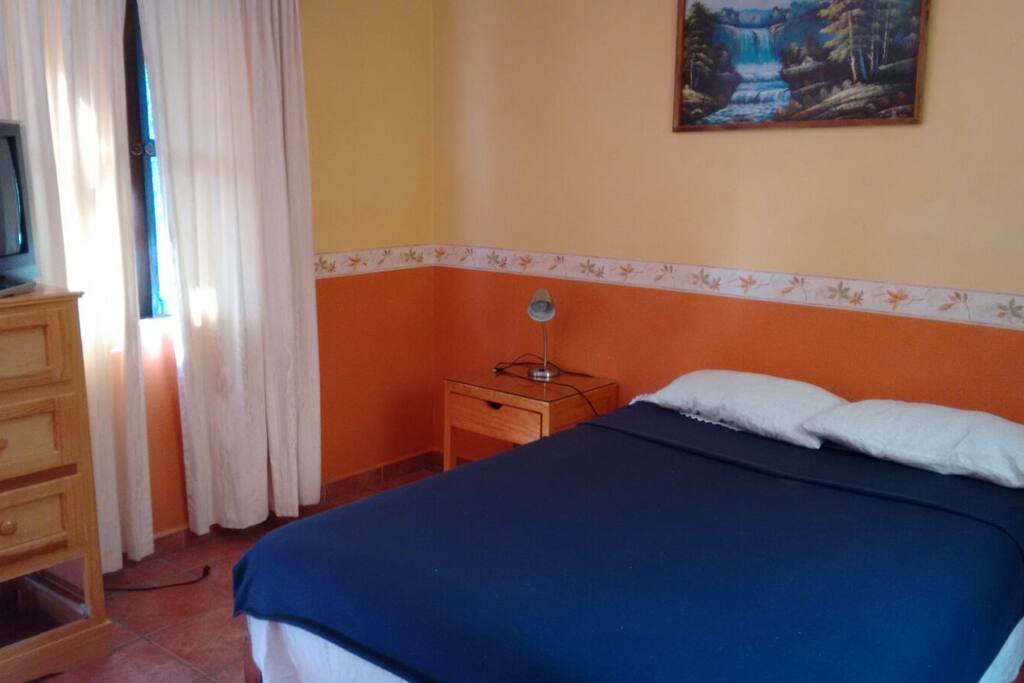 The bed is perfect for 2. TV, small fridge and microwave are inside the room in case you want to cool your beverages or warm food.