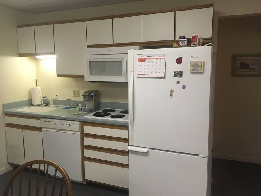 Kitchen with Keurig, toaster, electric teapot, spices, etc.