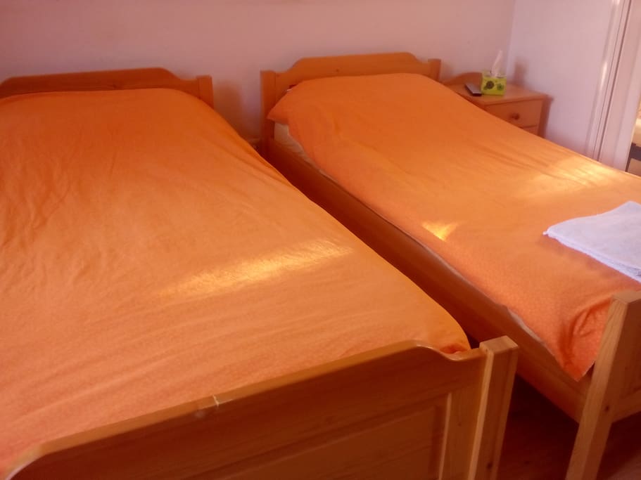 two separate single beds in one room