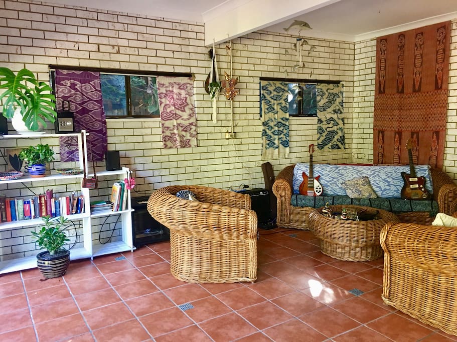 spacious studio with large 4 seater couch and 2 single armchairs where you can relax after your day on the beach