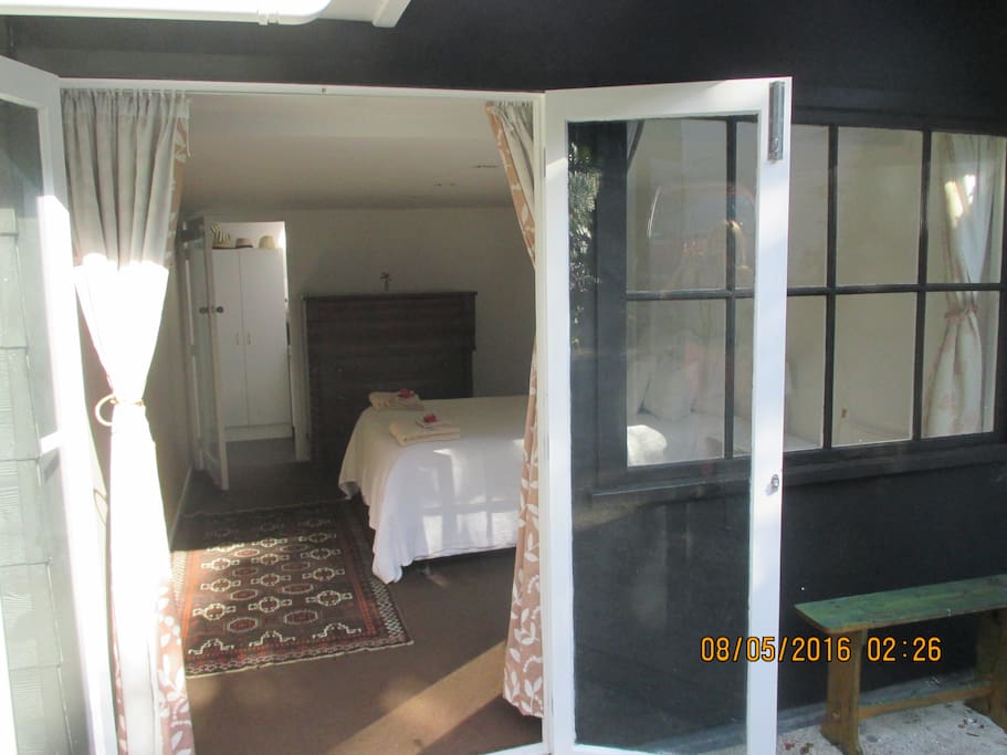Entrance through French doors to Bedroom