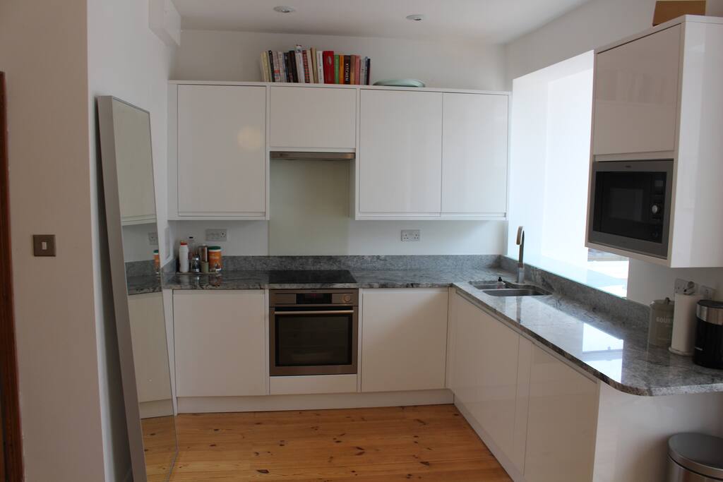 Beautiful new kitchen. Kitchen has a working oven, microwave and washer/dryer.