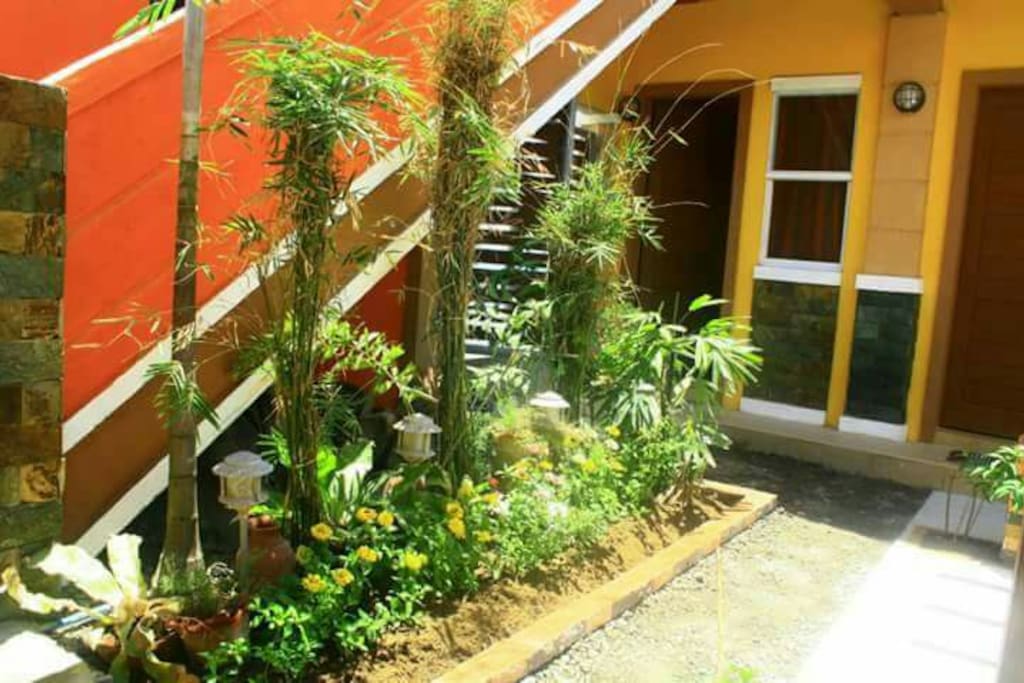 The stairs going to the roof deck. The door in this picture is Room 1, which is nearest to the gate going to the beach.