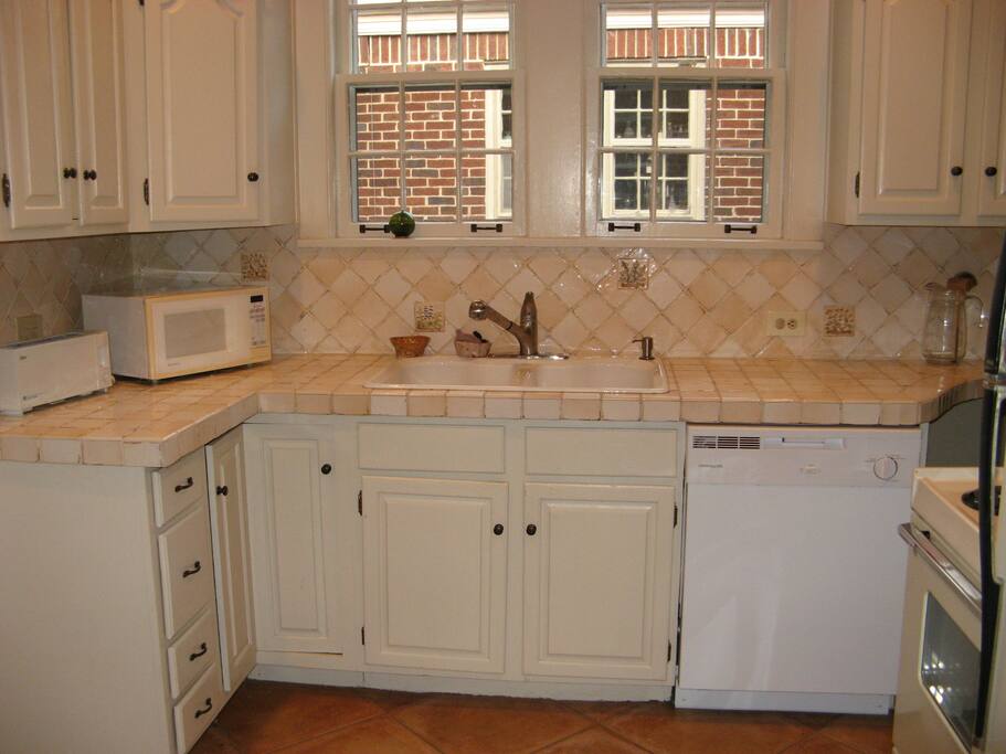 Full kitchen stocked with cooking utensils