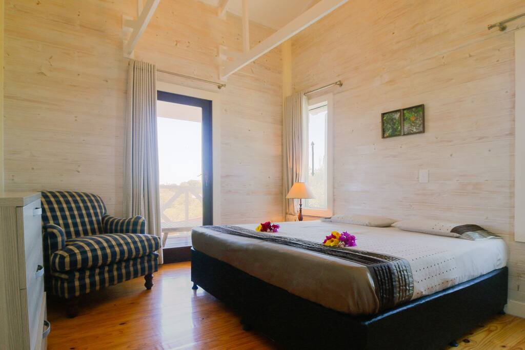2 identical bedrooms - each bedroom includes 2 single beds, 1 dresser, and 1 private bathroom