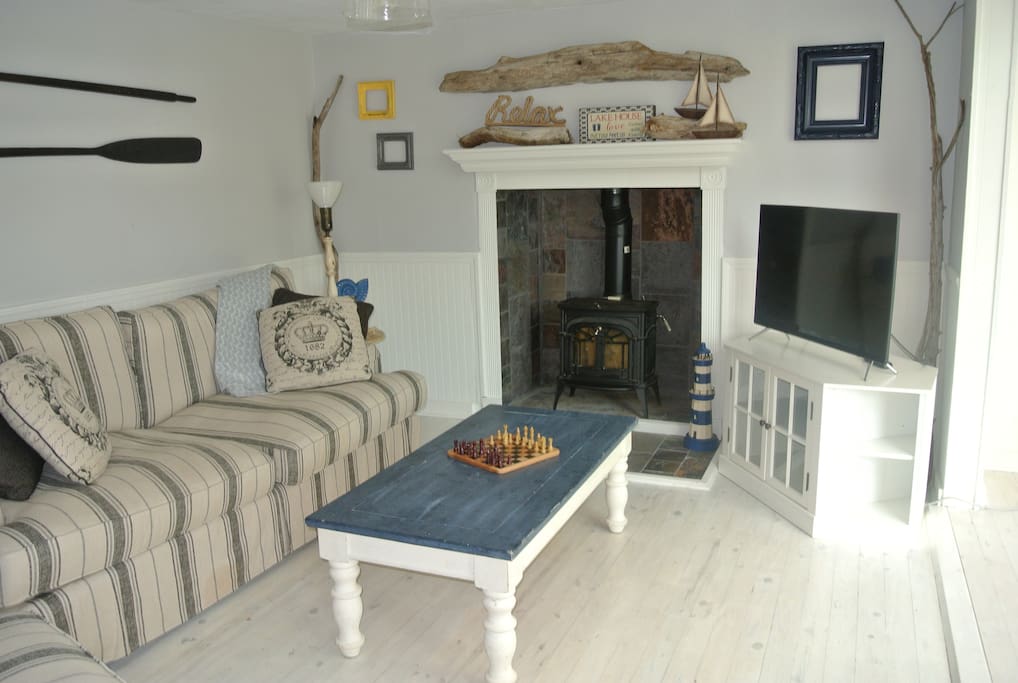 Spacious living room with wood-burning fireplace