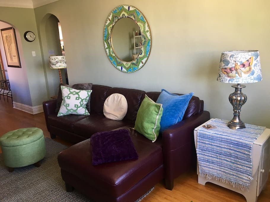 Spacious living room area with open layout next to the dining area.