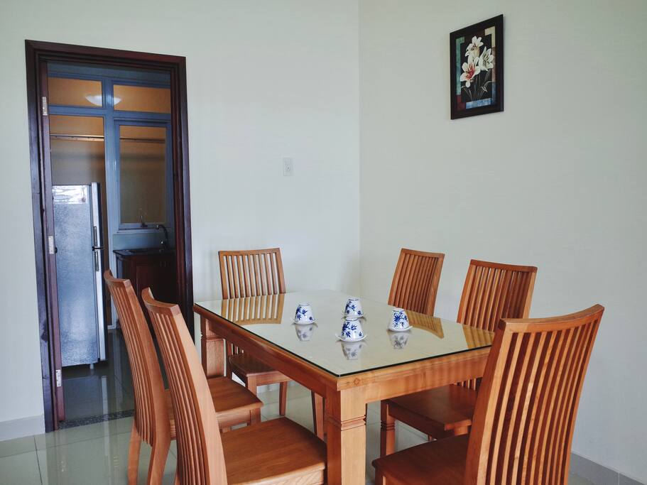 Dining table is next to the kitchen