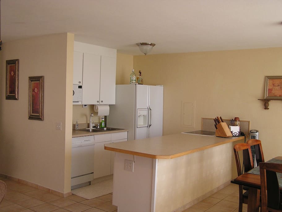 Fully stocked kitchen with Fully stocked kitchen with dishwasher.