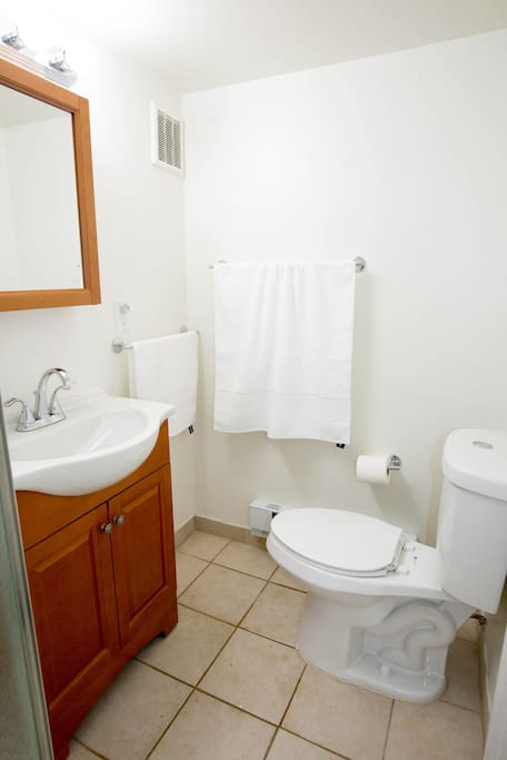 Full bath with glass enclosed shower