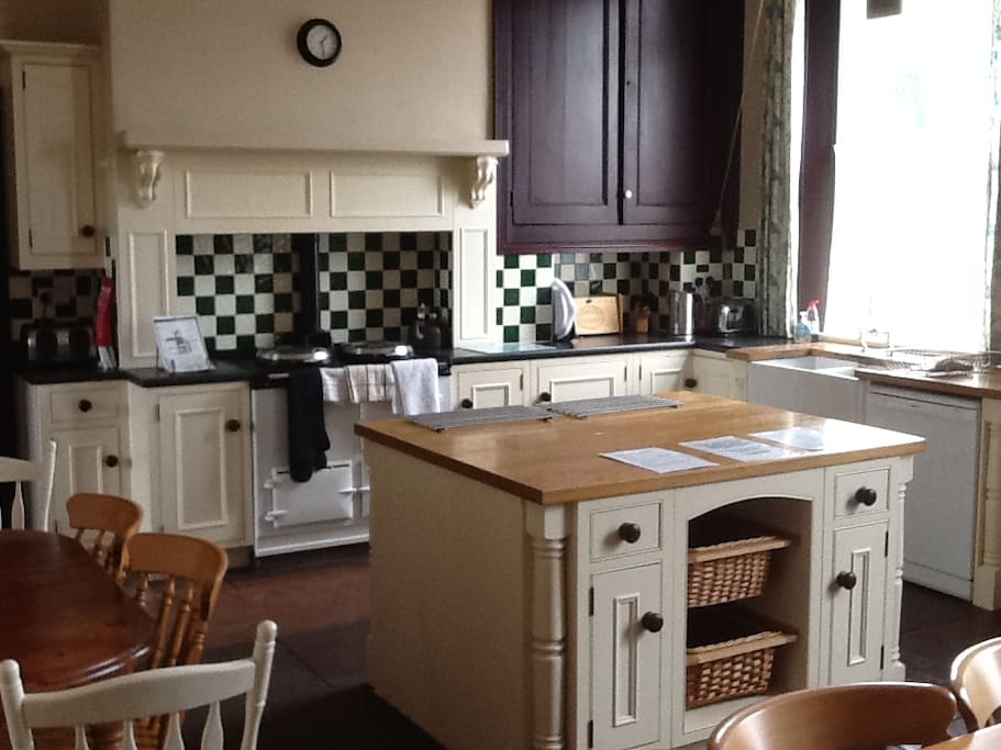 Kitchen with AGA cooker and room to dine.