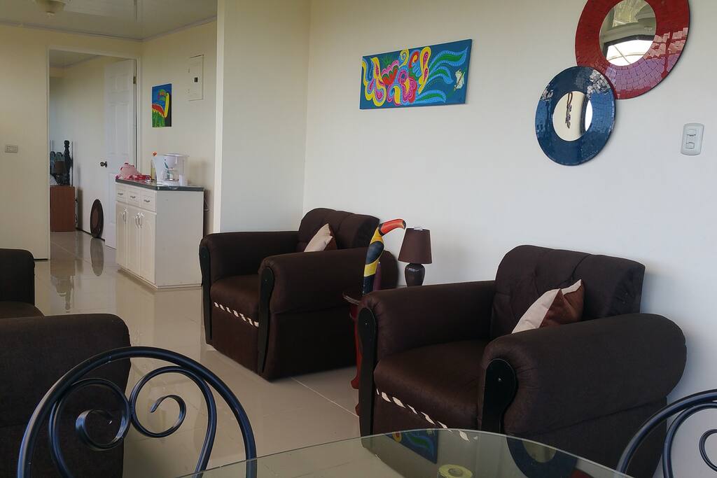 Living room with sofa and two armchairs.
