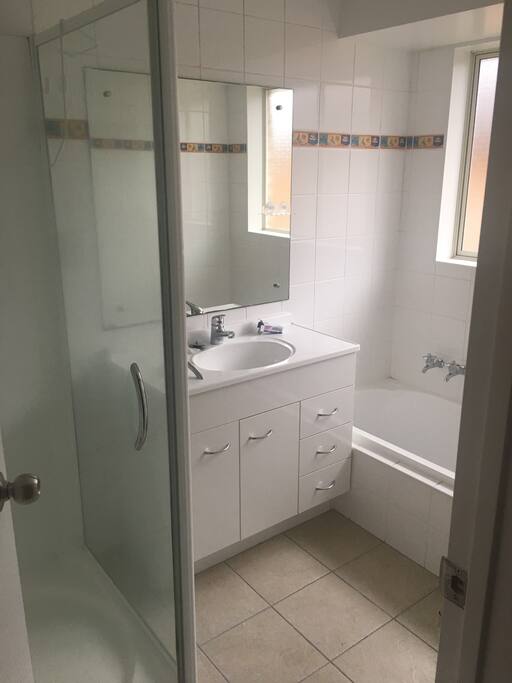 Shared bathroom with a bath tub for your relaxation