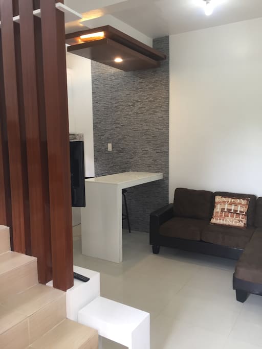 Minimalist Living Area, dining and kitchen at downstair of the apartment, with tv and fully airconditioned.