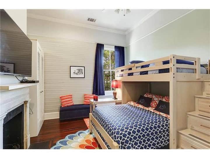 The second bedroom is cheery and bright and can accommodate up to three people.