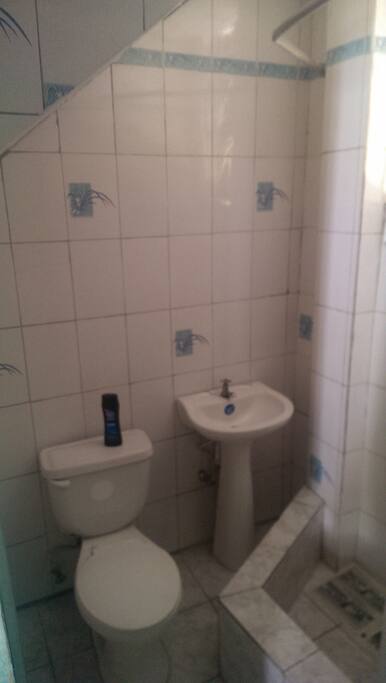 a section of the bathroom of the room showed before.