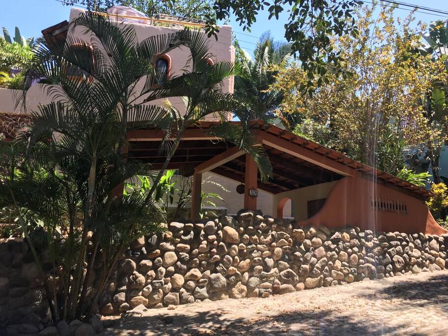 stone wall and carport