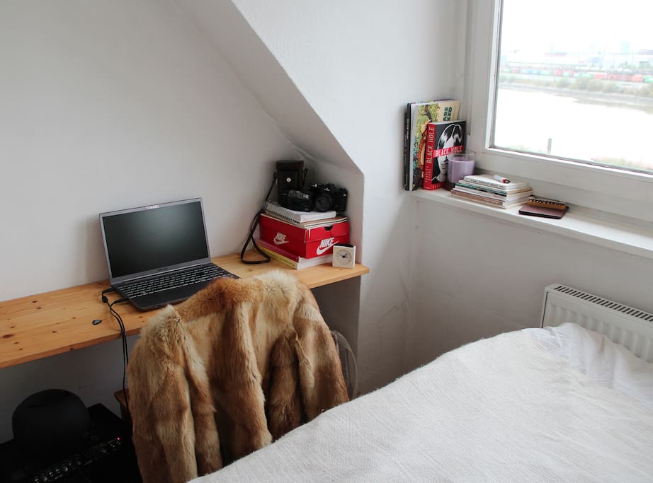 The desk in the bedroom (with an amp and a bunch of electric sockets underneath)