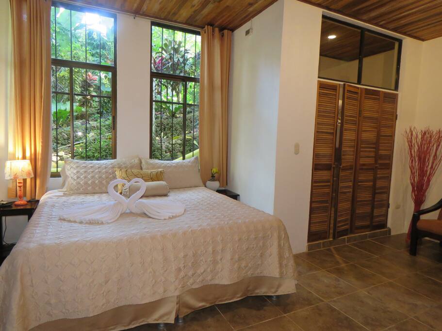 Large Master Bedroom with King bed, A/C, Large Closet, Loveseat. All pictures of Villas and animals are taken with our camera on/or from Jungle Creek.