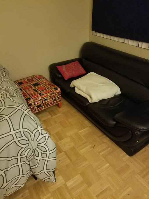 Leather couch. Designer foot rest.