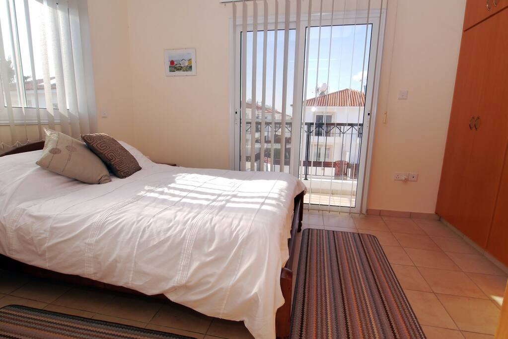 double bedroom with pool view balcony