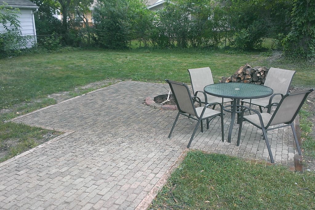 Spacious backyard with firepit