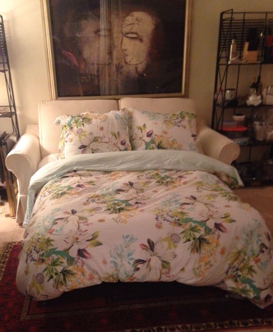 This full size pullout bed can accommodate additional guests. It can be folded in to provide additional seating.