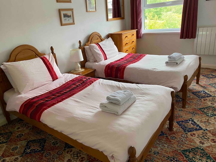 Roomy twin bedroom with views