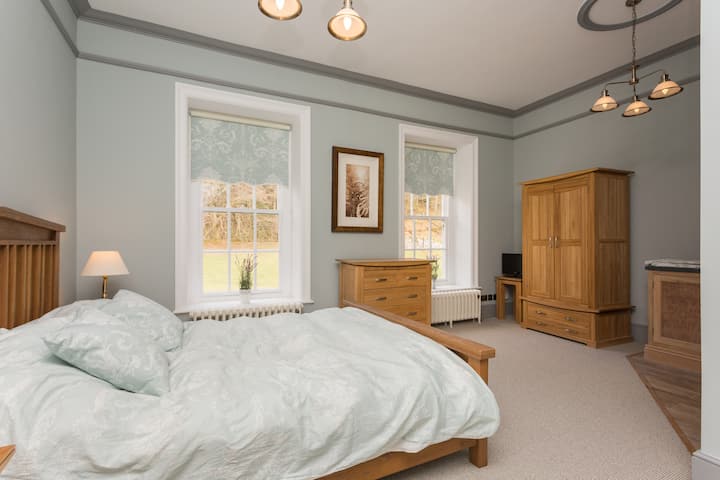 The Grandsea Bedroom (king size bed), with view over the meadow and woodland