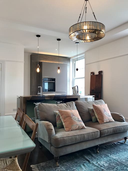 Living room with open kitchen and dining table