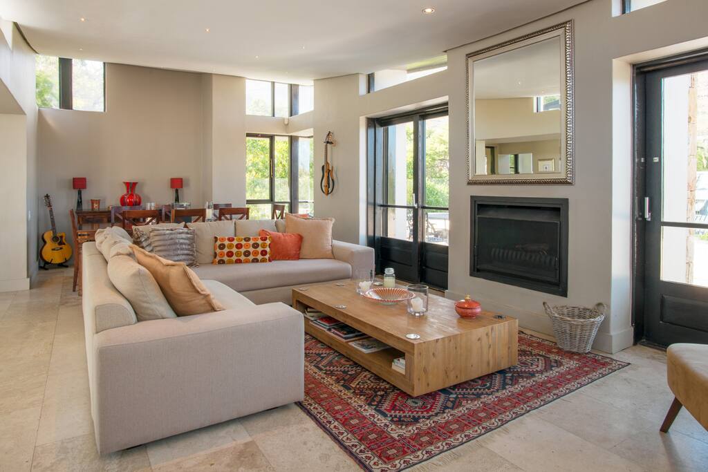 Modern TV room that opens up to the balcony