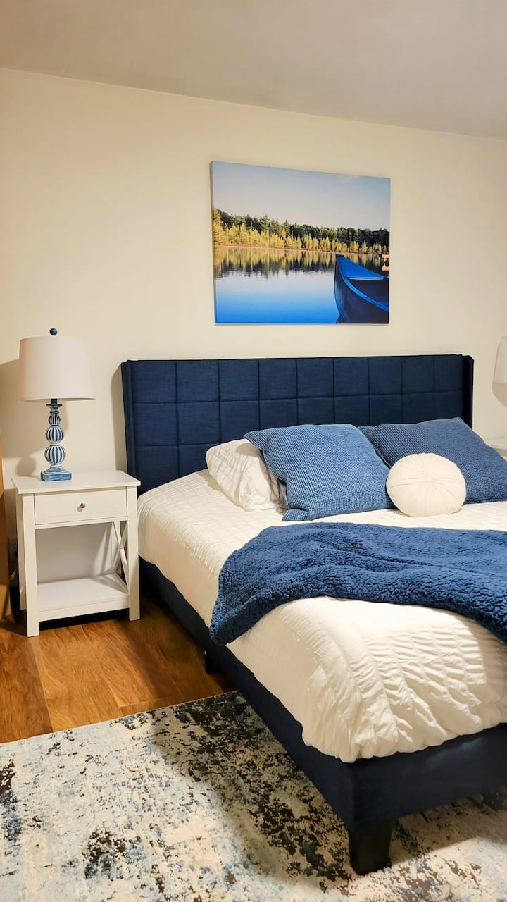 KING BED in this large room with a desk and chair too.