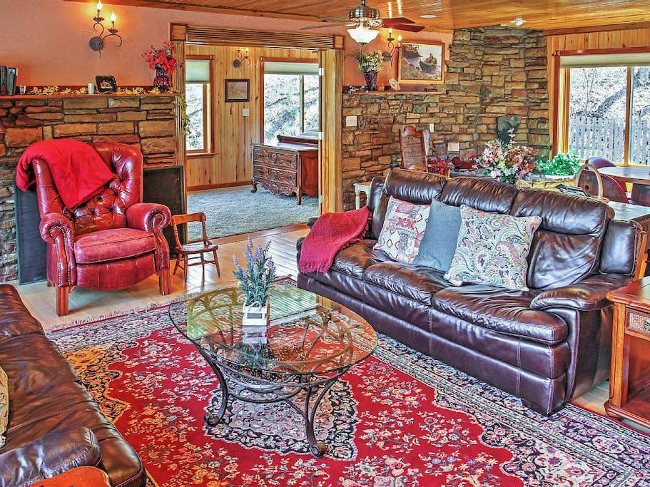 The great room view 2 leather couches and comfortable seating