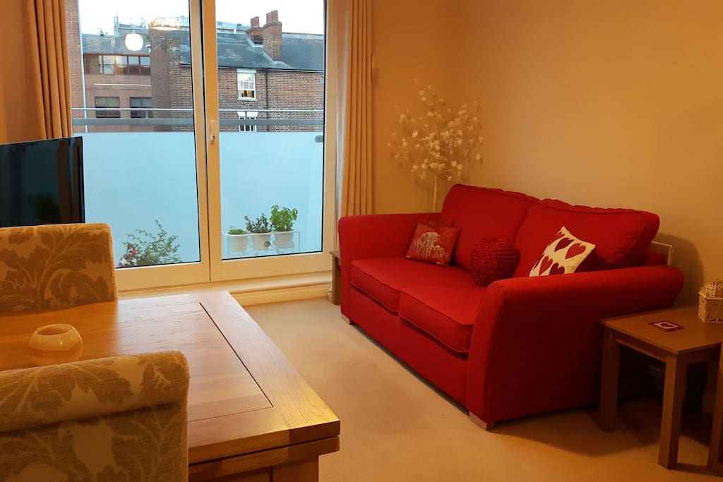 Double sofa bed. Dining room table (there are four chairs in the flat). Double doors can open fully for fresh air and to enjoy the sunshine.